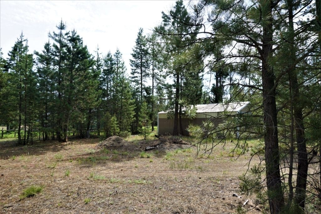 Large view of 1.00 Ac In Crescent Oregon! Treed Lot W/ Power & 20 X 30 Metal Building! Near BEND Photo 2