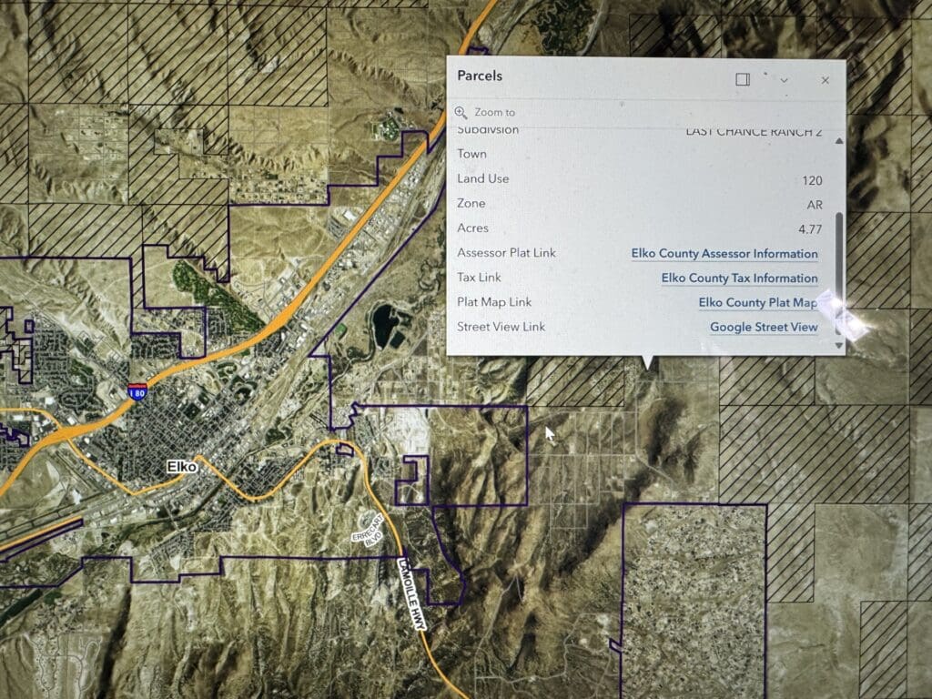 Large view of 4.77 ACRES IN BEAUTIFUL ELKO COUNTY, NEVADA ~ SPRING CREEK ~ MAJESTIC RUBY MOUNTAIN VIEWS AND TIMBERED! Photo 9