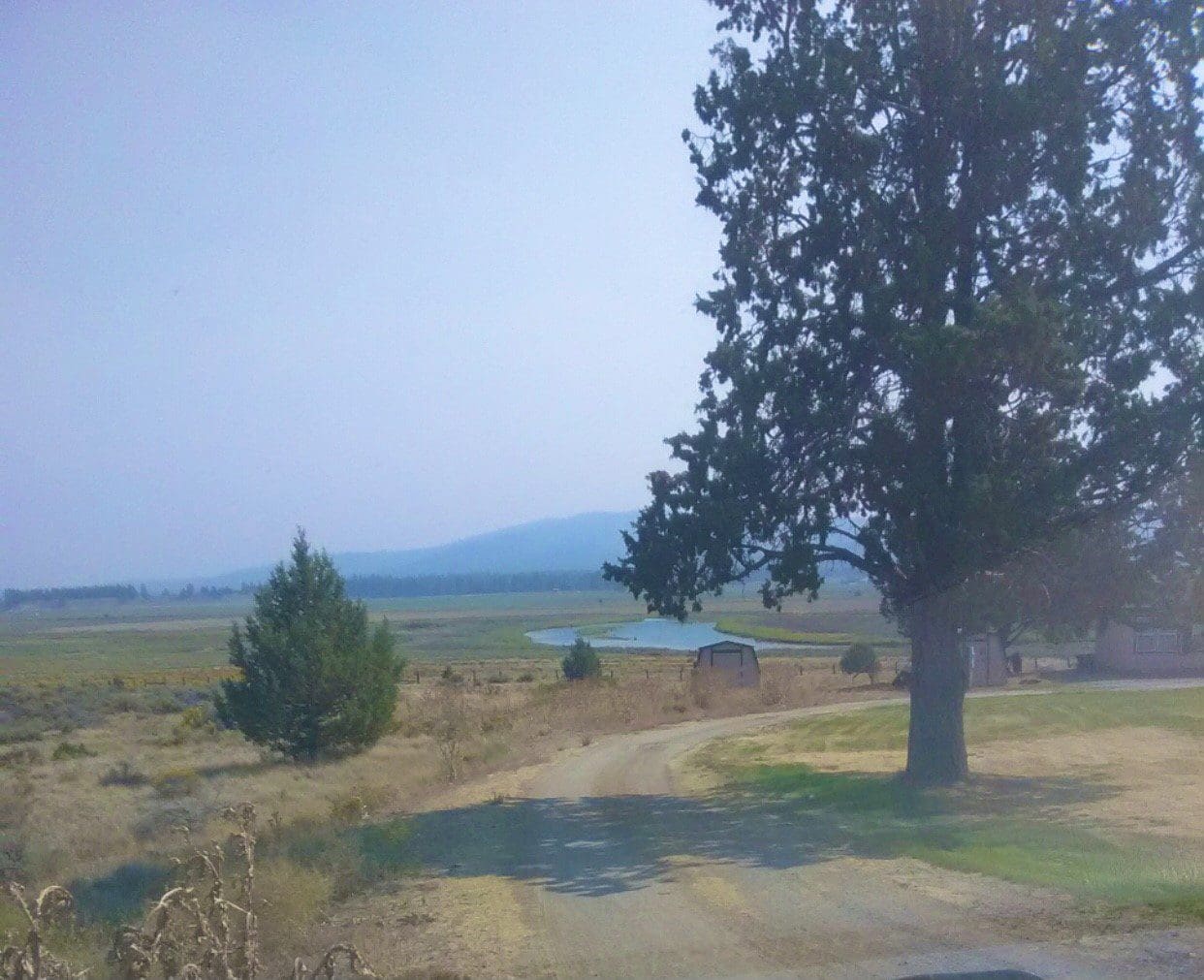 1.58 ACRES ON THE BEAUTIFUL SPRAGUE RIVER~SHED,SEPTIC WITH PERMIT, POWER POLE DROP, PARTIALLY FENCED WITH PAVED ROAD FRONTAGE photo 1